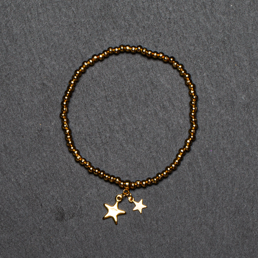 Elasticated Star Charm Bracelet In Gold Plate
