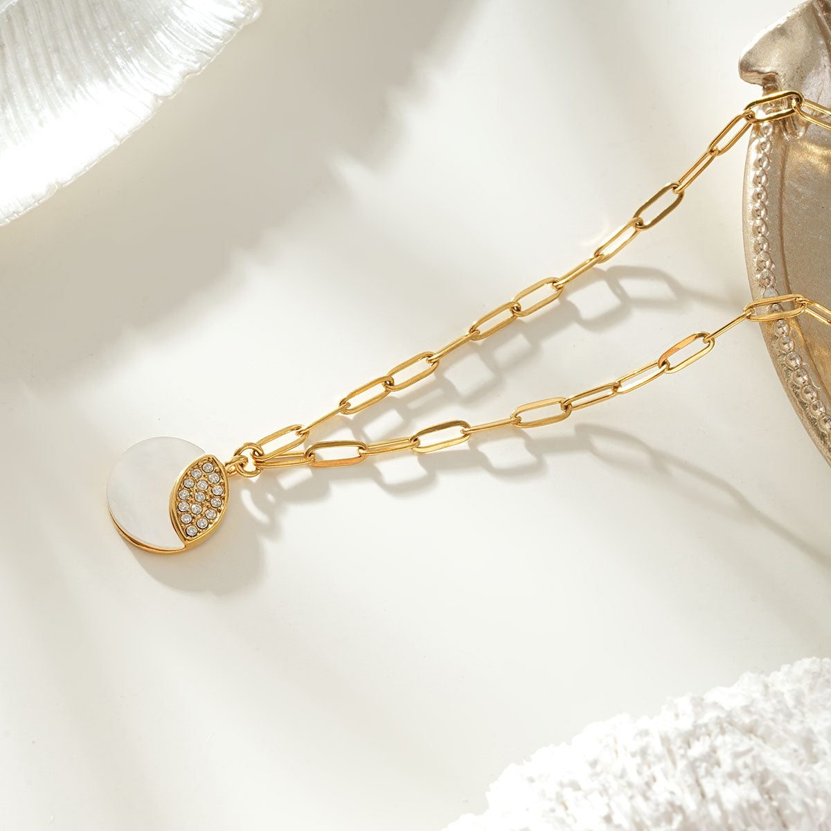 MOGGNA Gold: Coastal Shell Charm Necklace with Oval-Cut Zirconia Inlay