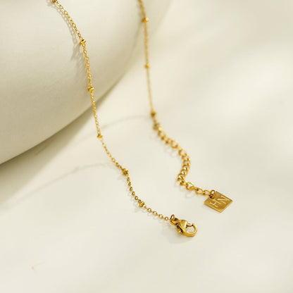 UNLOK Beaded Gold Chain with Zirconia Embellished Key Pendant